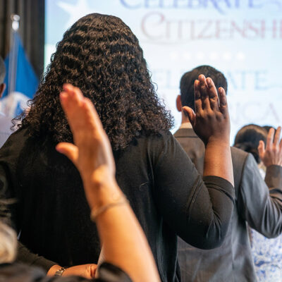 New naturalized US citizens take Oath of Allegiance at special naturalization ceremony.