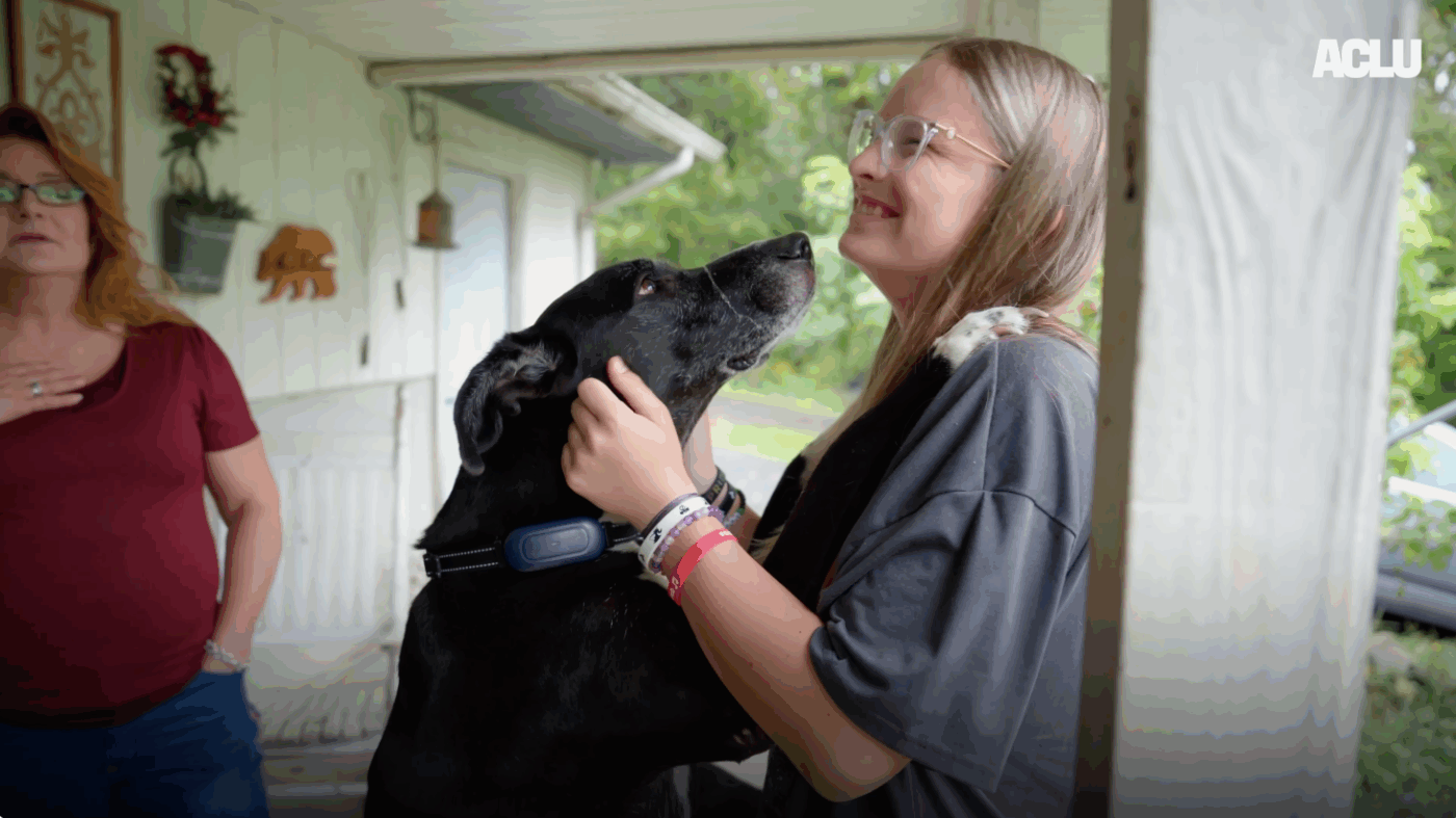 A screenshot of Becky Pepper Jackson playing with her dogs